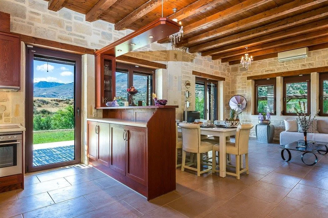 Kitchen opening to the pool terrace